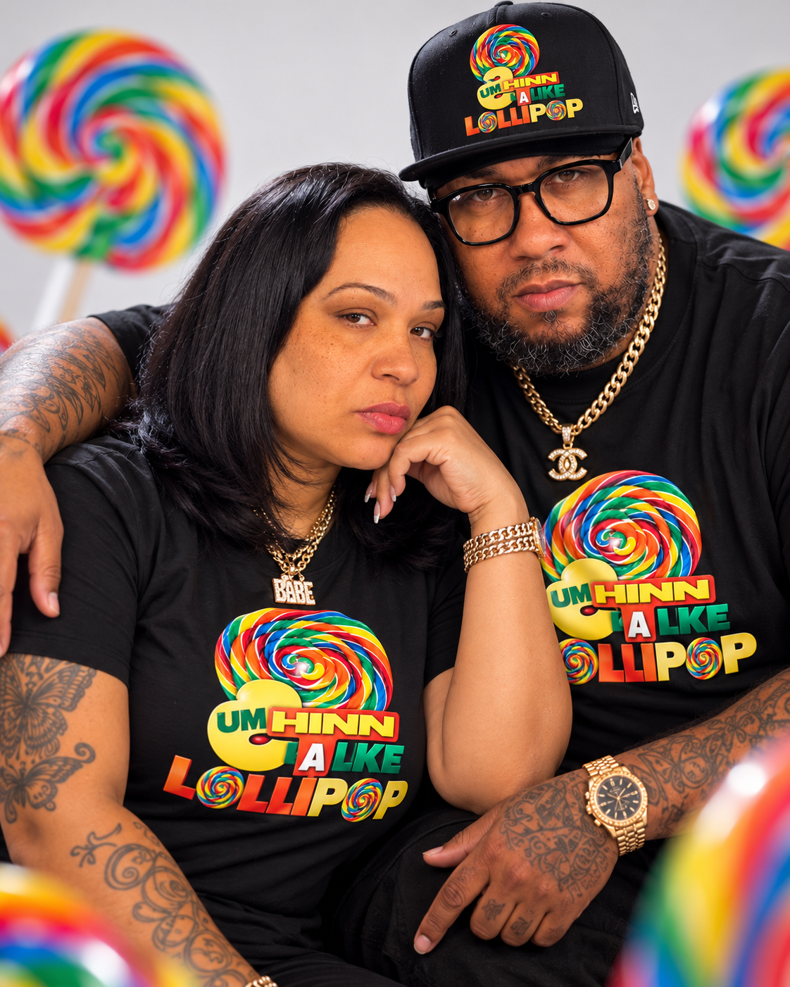 Close-up portrait of the owners wearing their rainbow-logo apparel